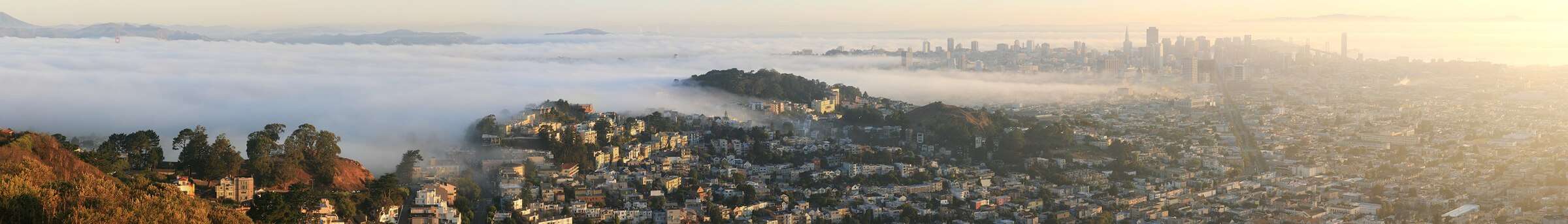 San Francisco under morning fog from Twin Peaks, with the Golden Gate Bridge and the downtown skyline